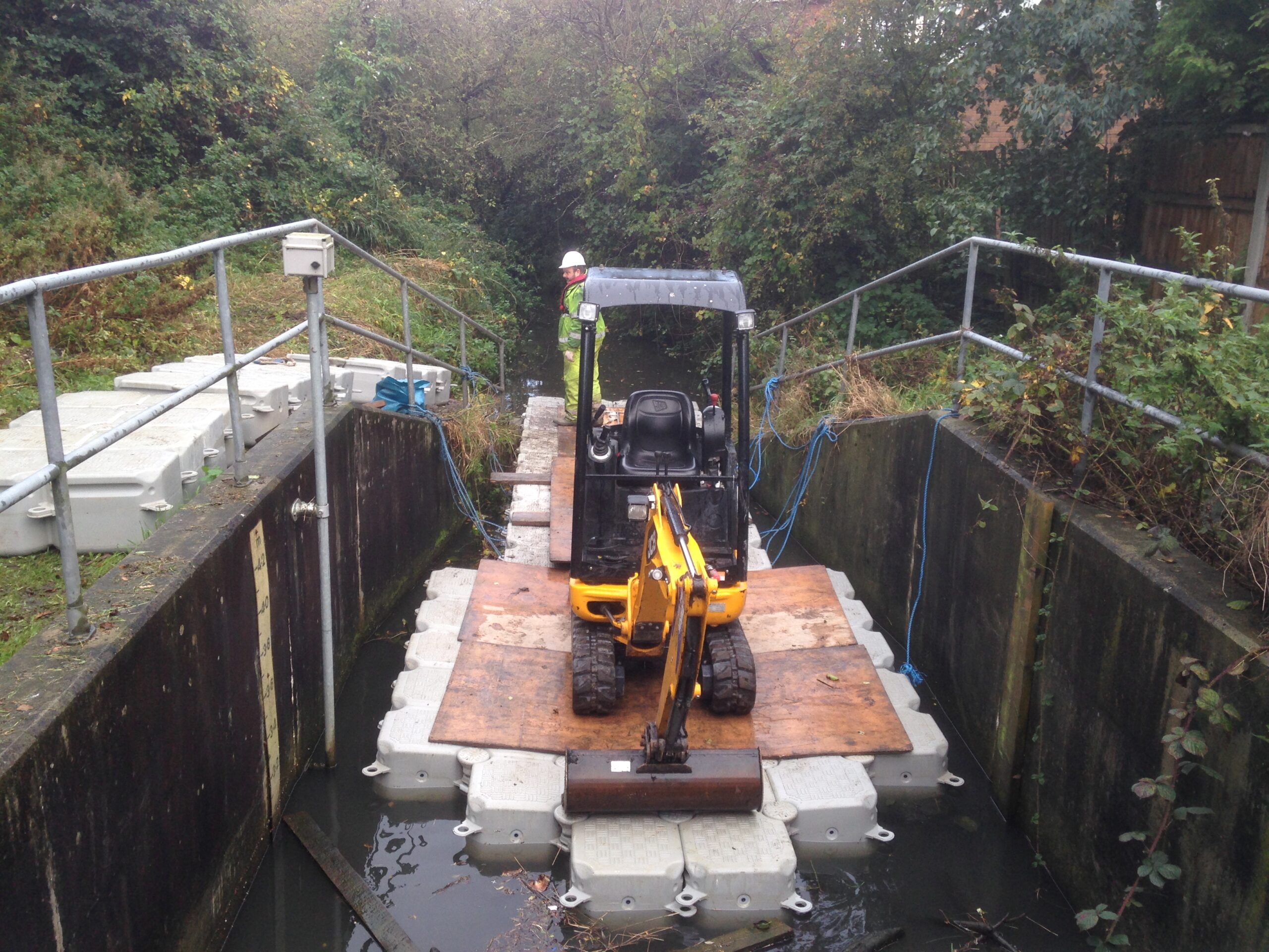 Modular floating pontoon positioned for maintenance access on a UK watercourse