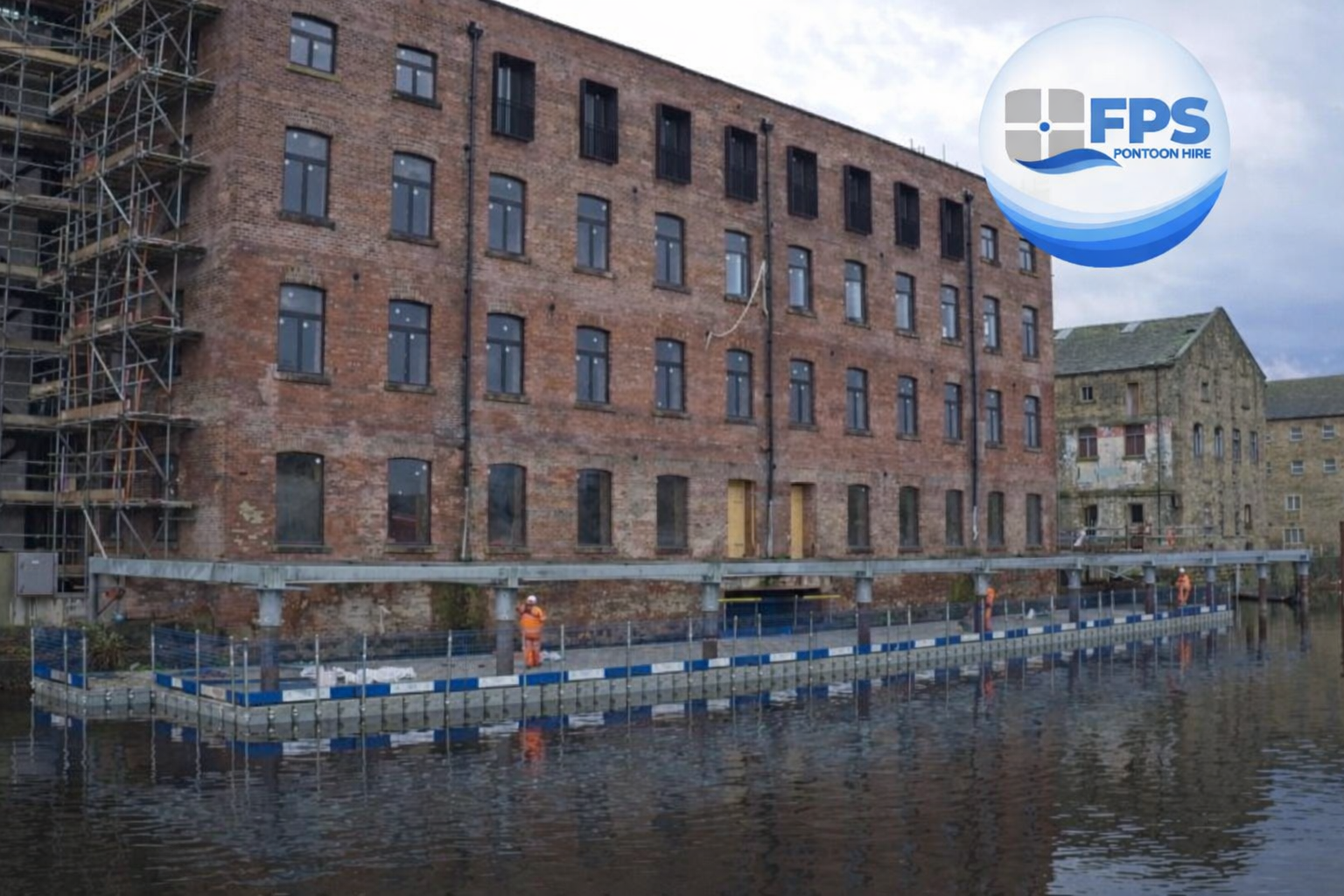 Modular floating pontoon platform around steel columns at Rutland Mills