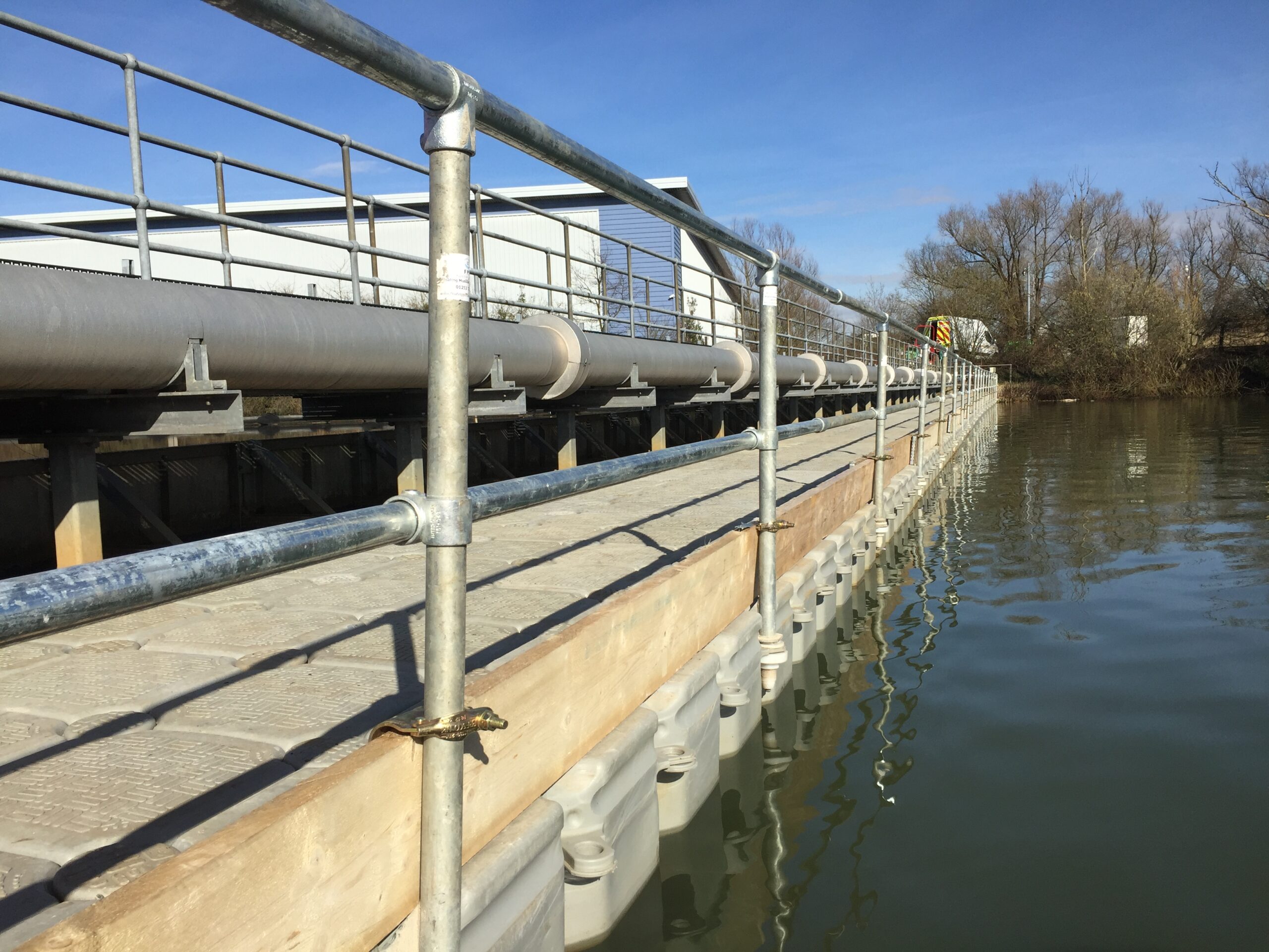 Modular pontoon walkway with edge protection providing reservoir maintenance access