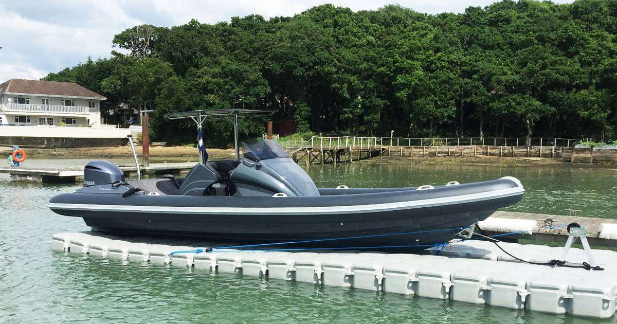 VersaDock drive-on dock with RIB moored alongside a modular pontoon walkway
